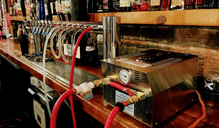 Beer line cleaning in progress at a busy bar